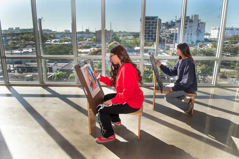 2 female students painting 